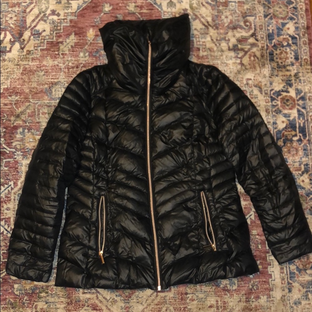 Chevron style black water proof puffer jacket.